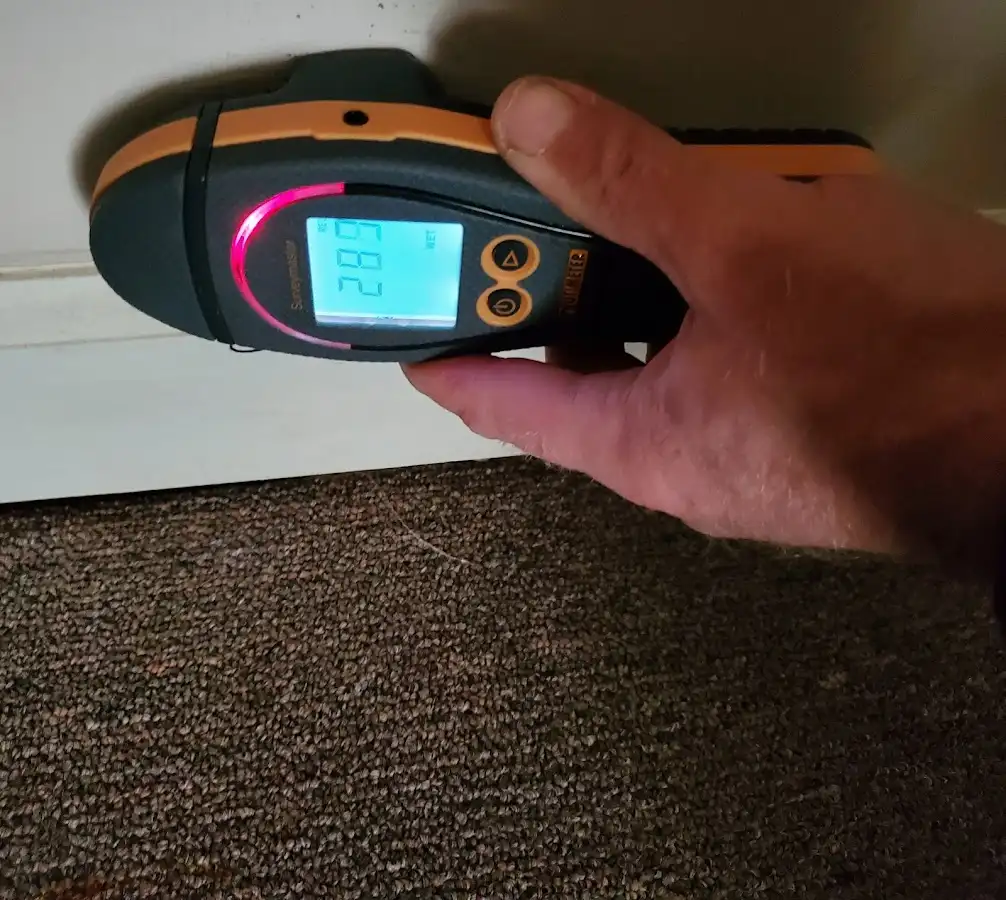 Moisture detection at baseboard during Burst Pipe Cleanup in Massillon